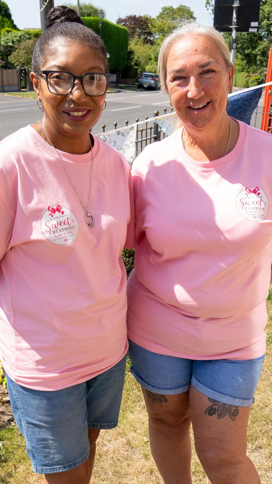 Dee and Debs together in their branded pink tops