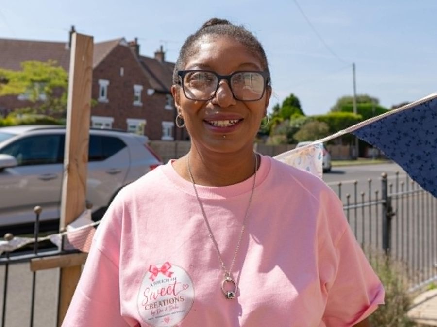Dee wearing an A Touch of Sweet Creations branded top