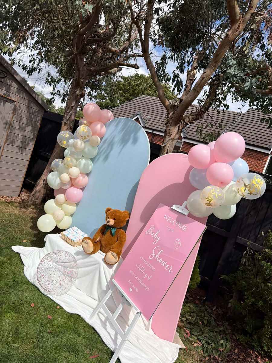 Celebration setup featuring baby shower backdrop
