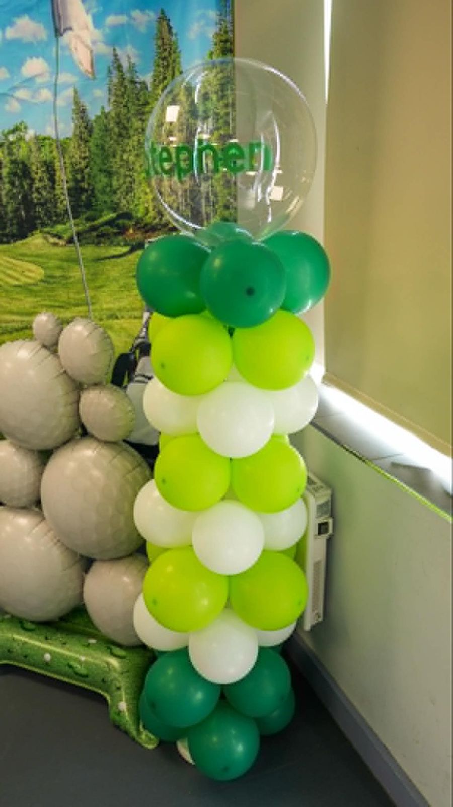Celebration setup featuring balloon column green