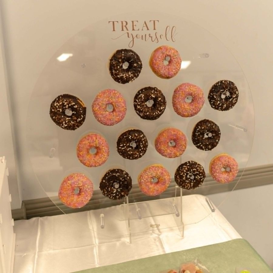 Celebration setup featuring donut wall