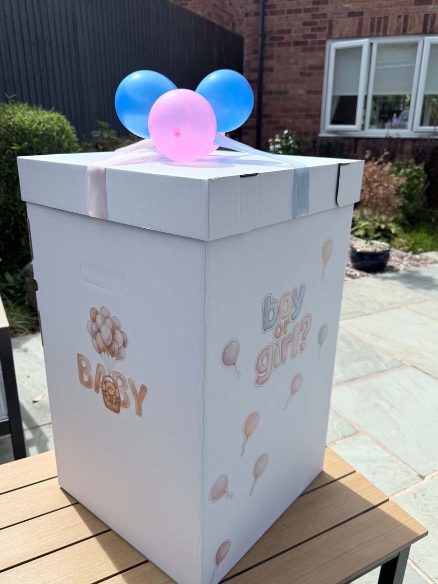 Celebration setup featuring gender reveal box