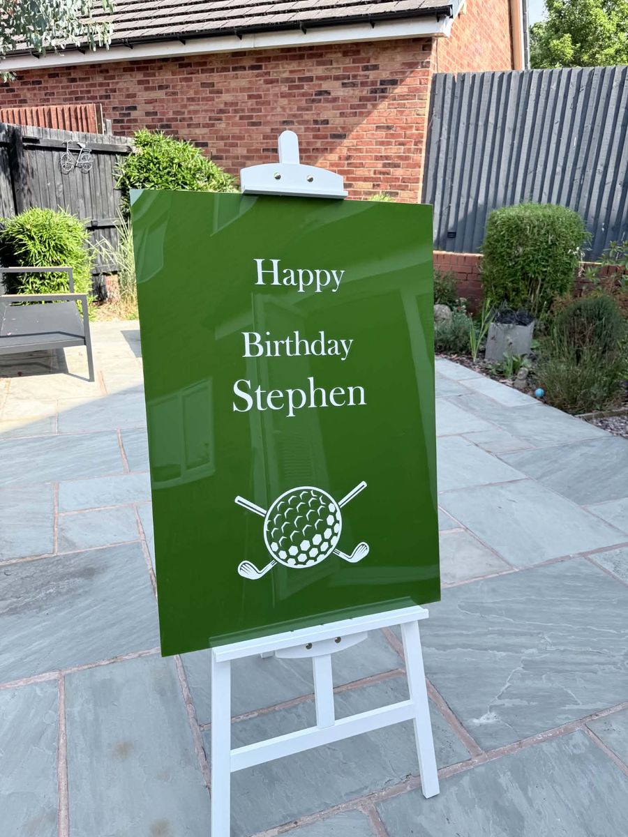 Celebration setup featuring golf birthday sign