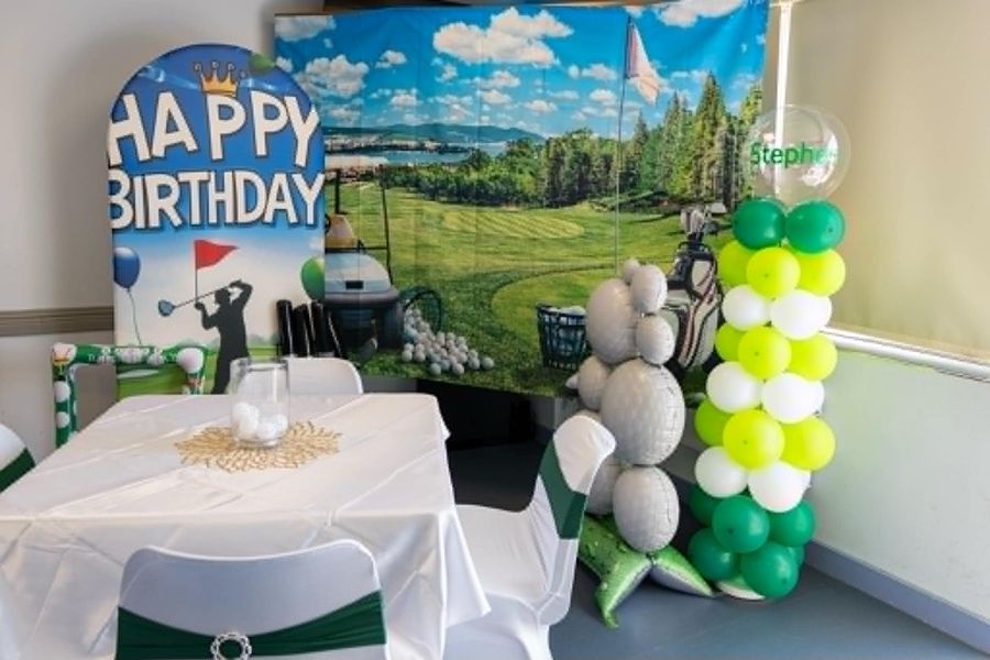 Celebration setup featuring golf birthday table