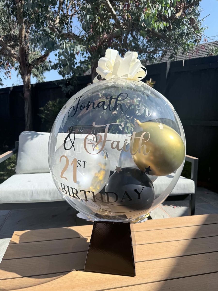 Celebration setup featuring personalised balloon 21st